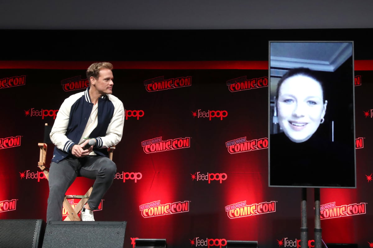 Outlander Sam Heughan and Caitriona Balfe (via zoom) speak onstage at the panel during Day 3 of New York Comic Con 2021