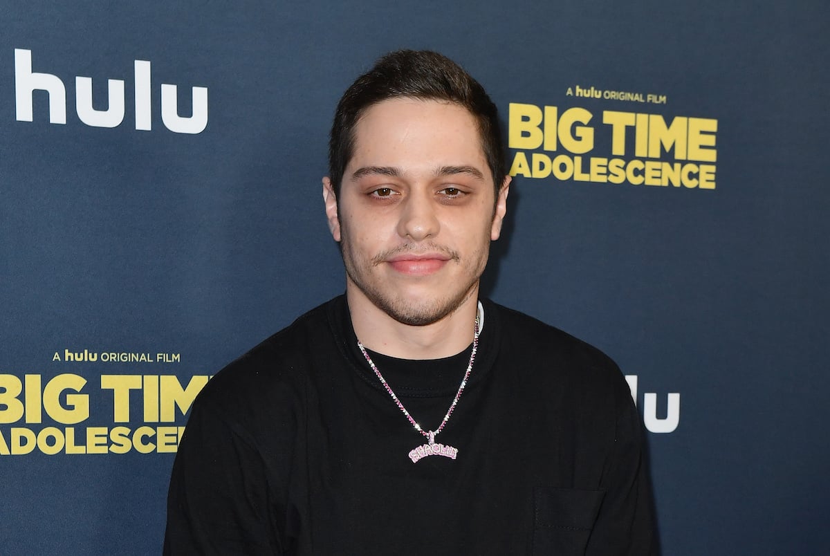 Pete Davidson smiles at an event.