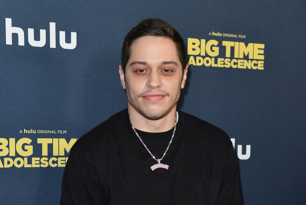 Pete Davidson smiles at an event.