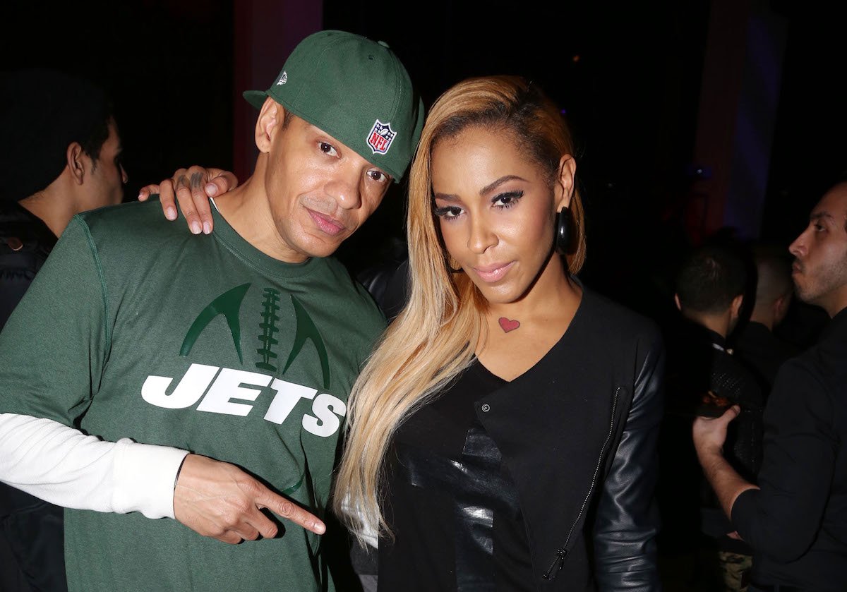 Peter Gunz and Amina Buddafly pose for a photo