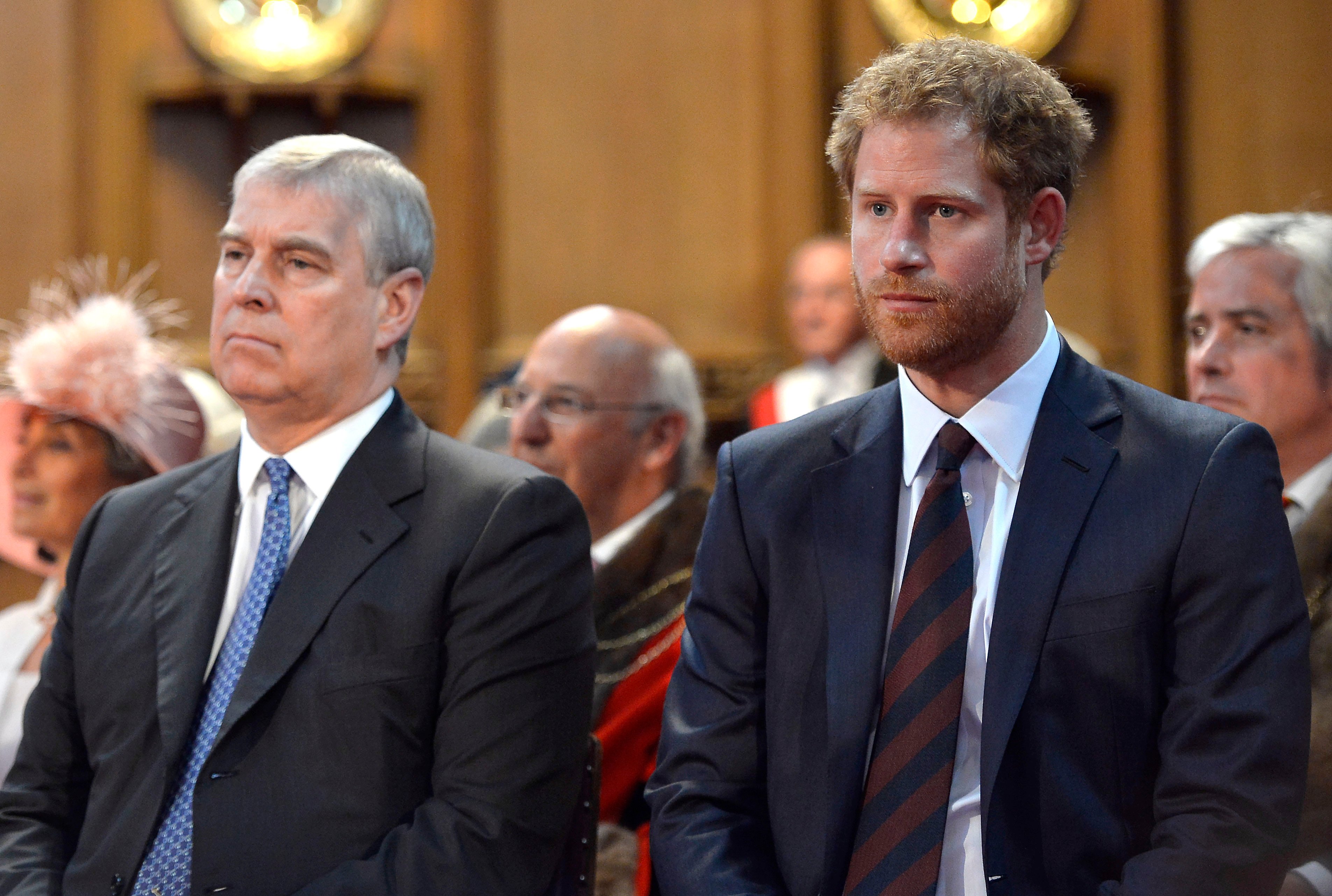 Prince Andrew and Prince Harry sitting next to each other during a reception at the Guildhall