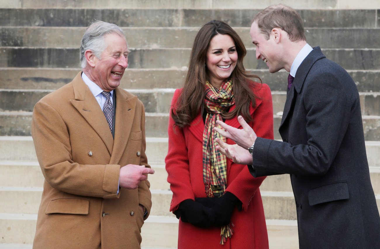 Prince Charles, Kate Middleton, and Prince William talking to each other