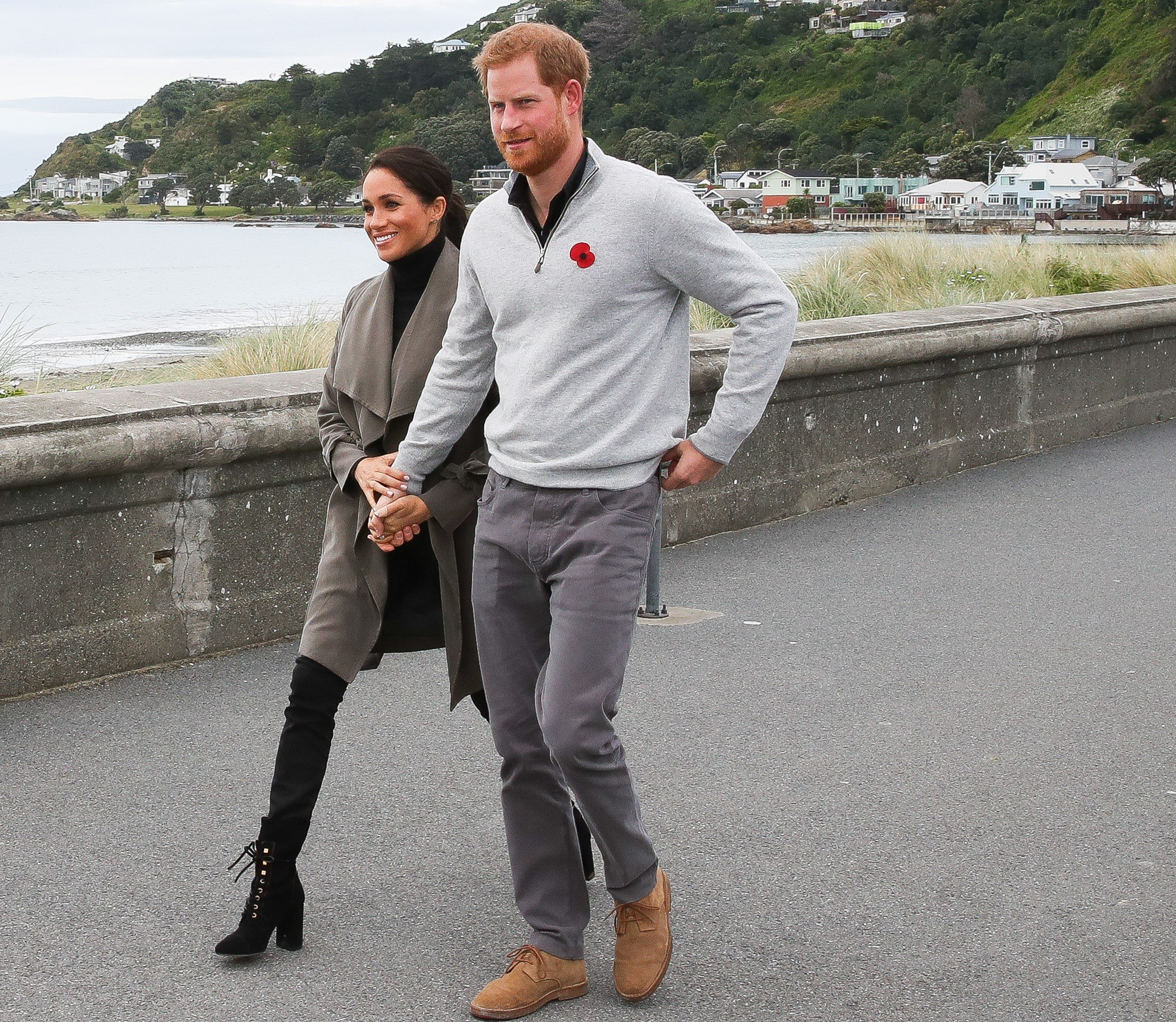 Prince Harry and Meghan Markle walking hand-in-hand to a cafe in New Zealand