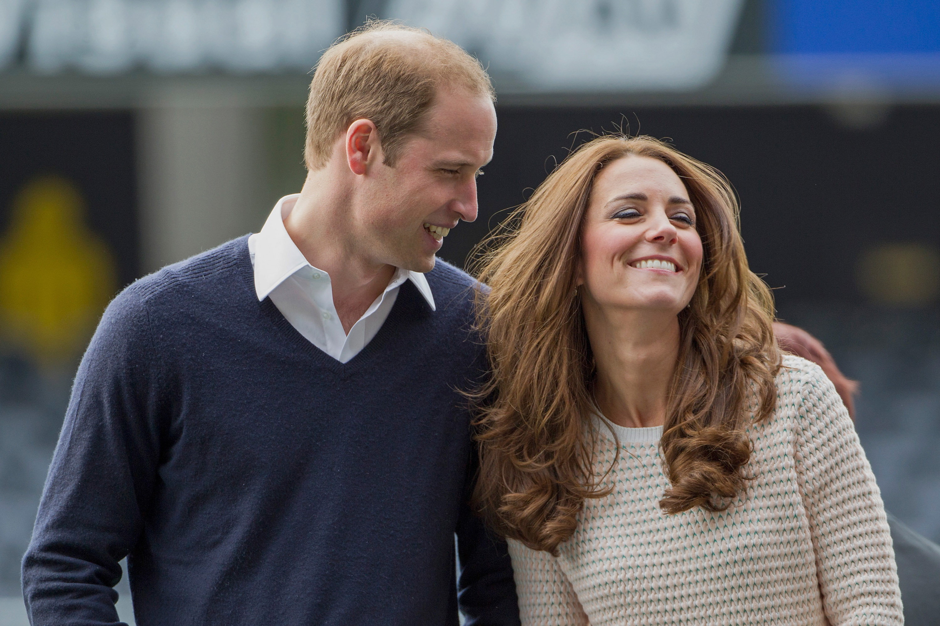 Prince William and Kate Middleton smiling as they attend 'Rippa Rugby' in the Forstyth Barr Stadium