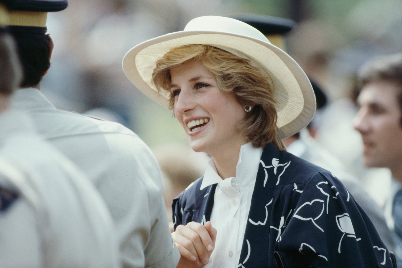 Princess Diana wearing a hat and smiling