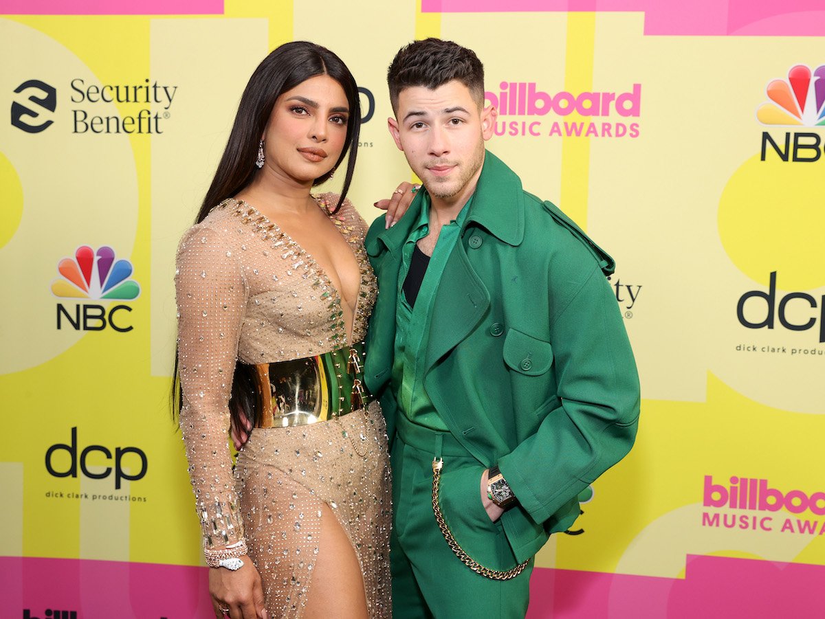 Priyanka Chopra and Nick Jonas pose together at an event.