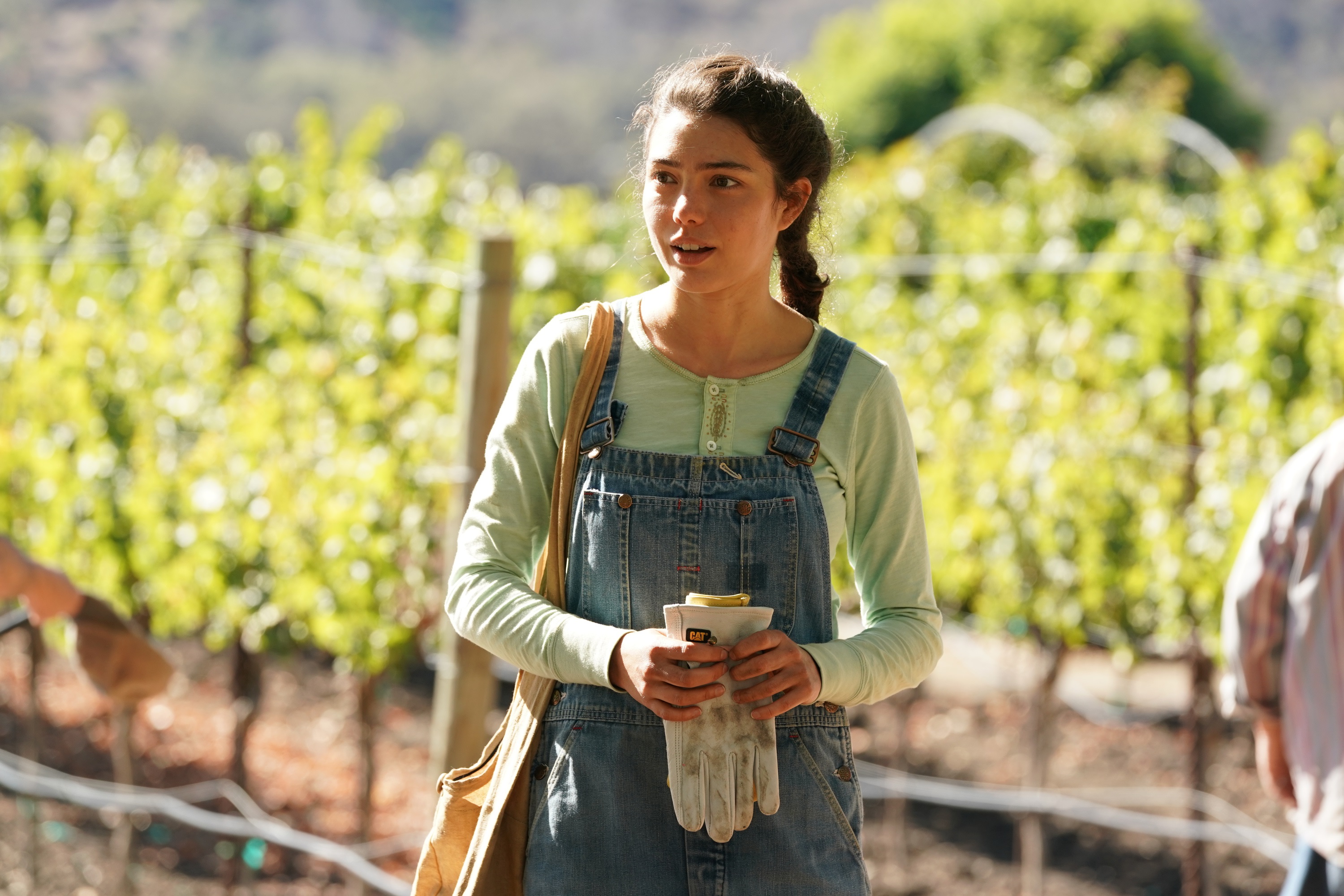 'Promised Land' cast member Katya Martín standing in a vineyard field
