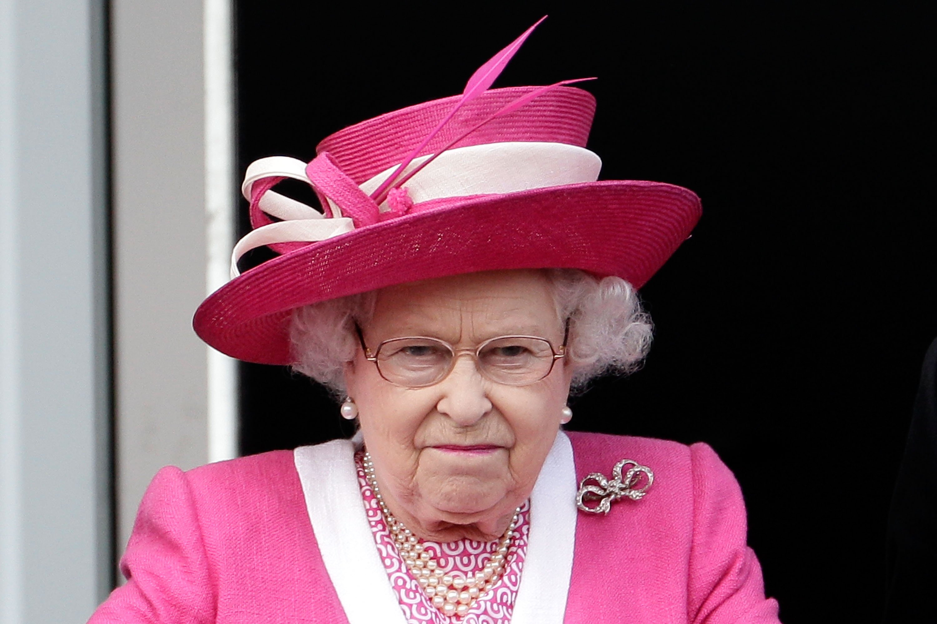 Queen Elizabeth II reacting after her horse fails to win the Epsom Derby