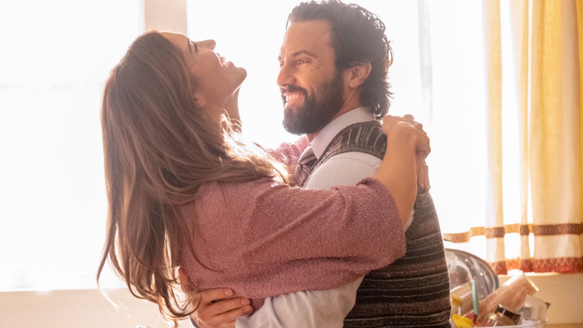 Mandy Moore as Rebecca and Milo Ventimiglia as Jack dancing in ‘This Is Us’ Season 6 Episode 1 hugging each other and smiling