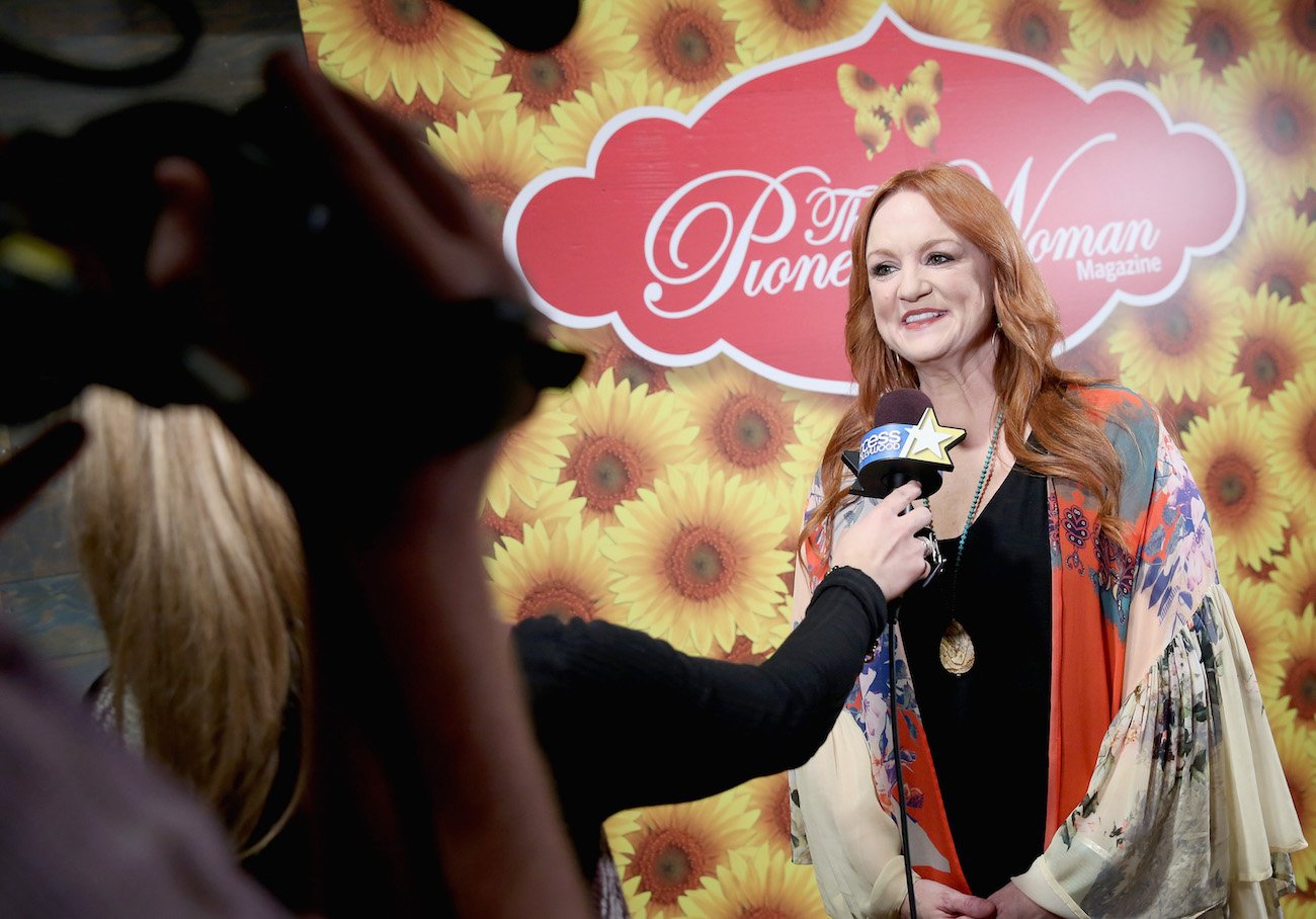 Ree Drummond speaks into a microphone during an interview wearing a black shirt