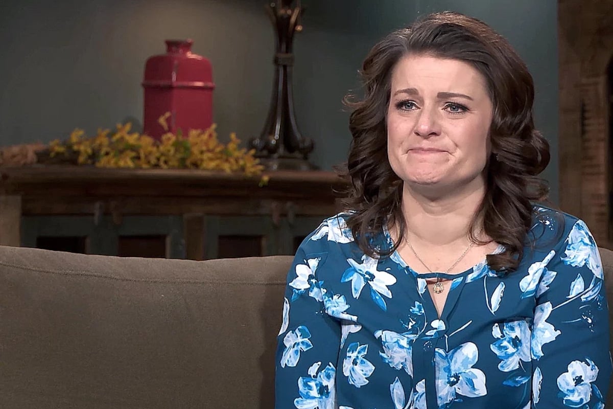 Robyn Brown crying and wearing a blue floral shirt on 'Sister Wives' | TLC