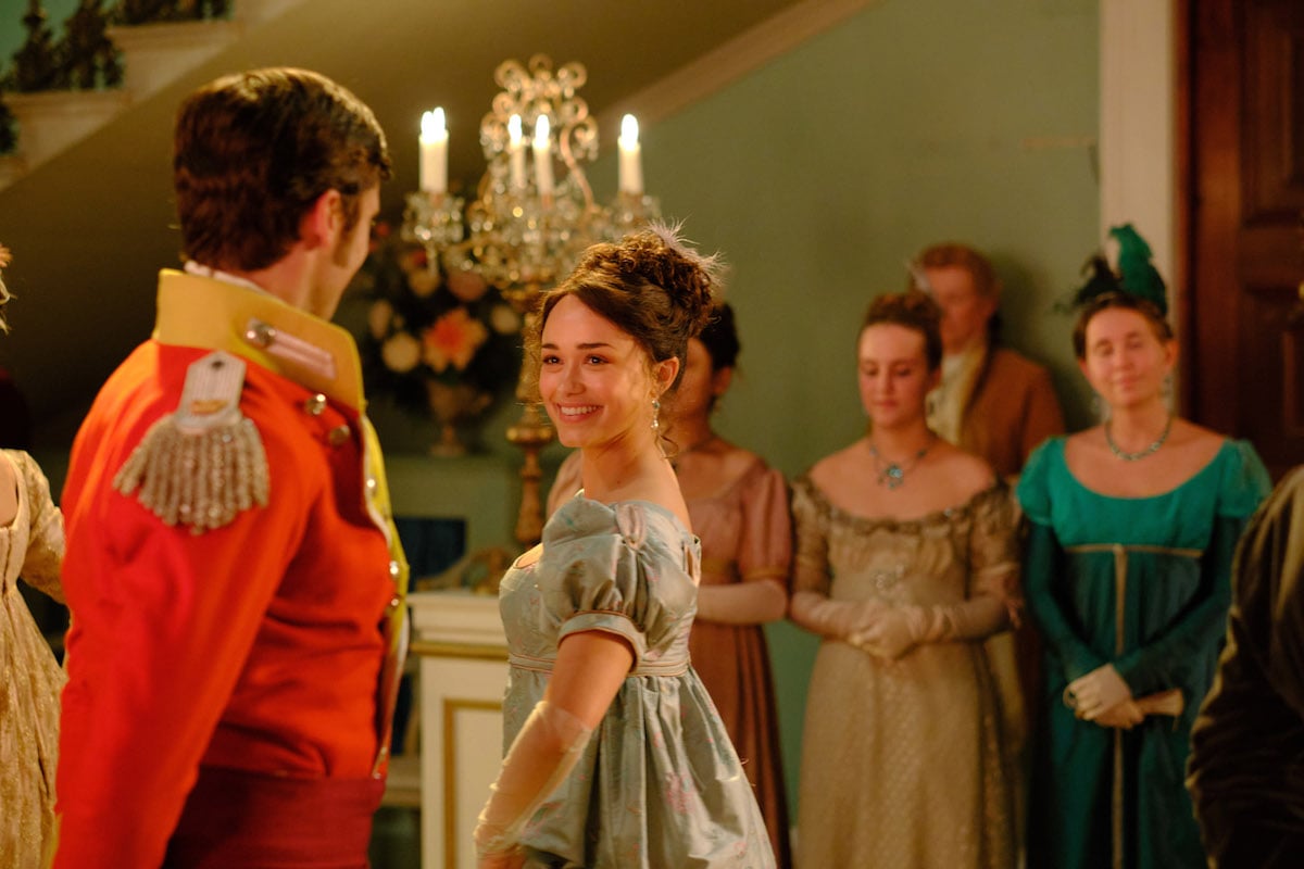 Charlotte (Rose Williams) dancing with a man in a red military jacket in 'Sanditon' Season 2