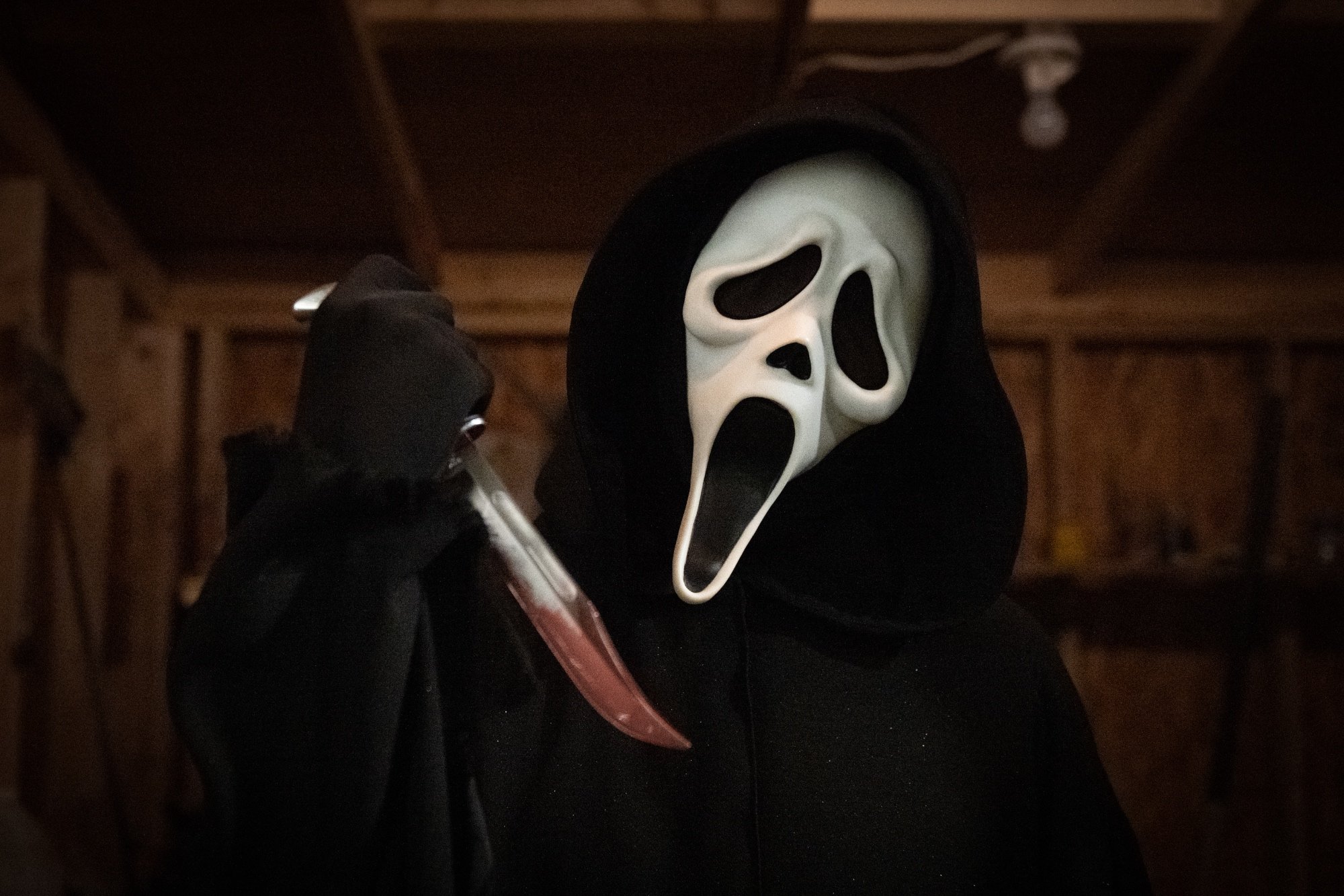 'Scream' Ghostface killer holding a bloody knife
