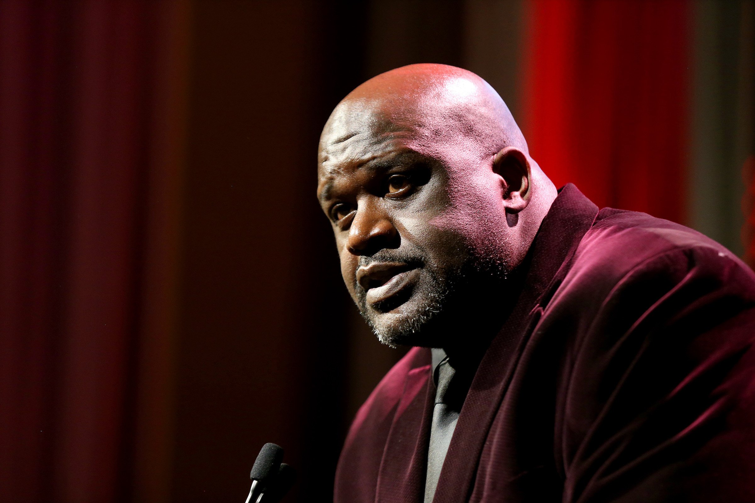 Shaquille O'Neal wearing a red suit