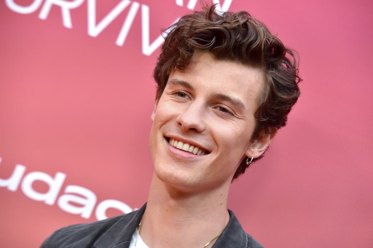 Shawn Mendes smiles at an event.