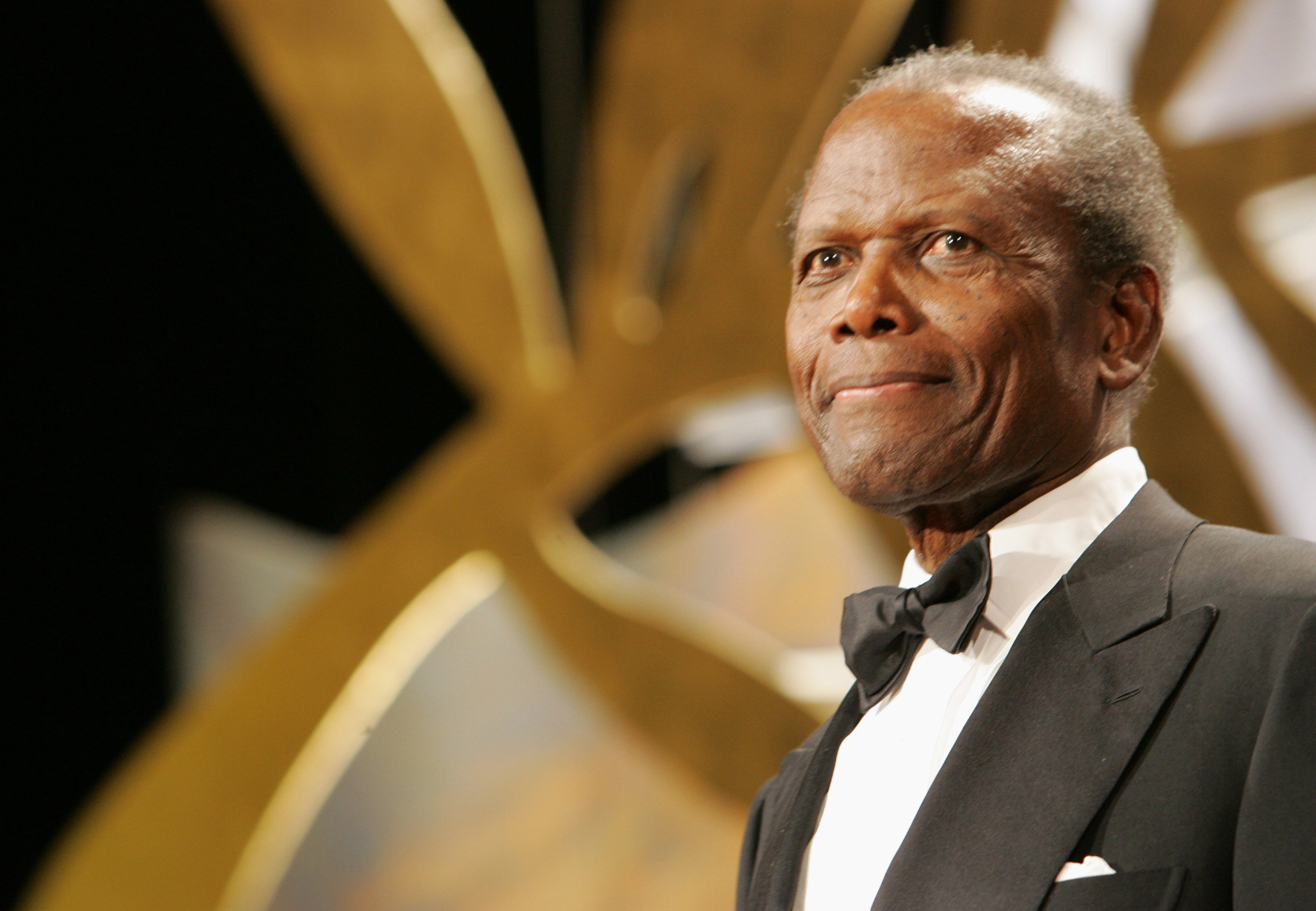 Sidney Poitier poses in a tuxedo.