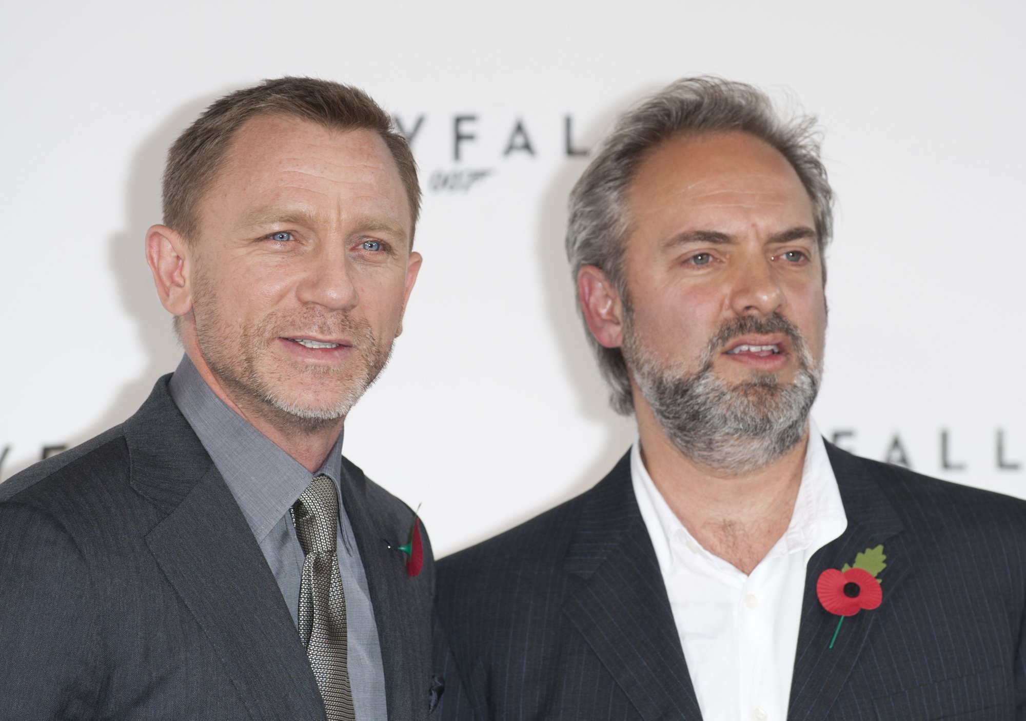'Skyfall' Daniel Craig and Sam Mendes in front of movie step and repeat