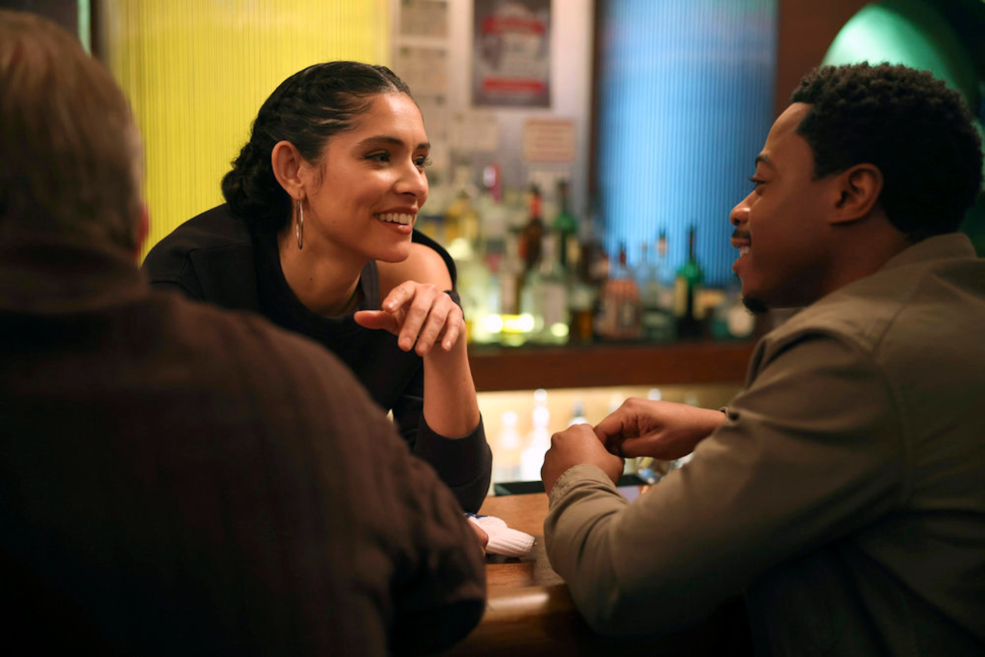 Miranda Rae Mayo as Stella Kidd and Daniel Kyri as Darren Ritter speaking across a table to each other in 'Chicago Fire' Season 10 Episode 11