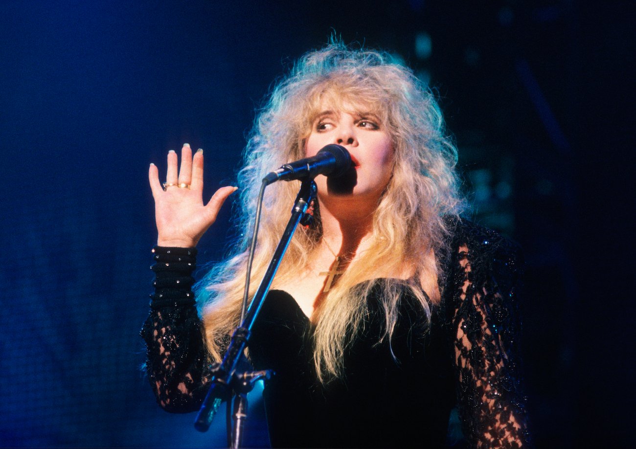 Stevie Nicks performing in black with Fleetwood Mac in Belgium, 1990.