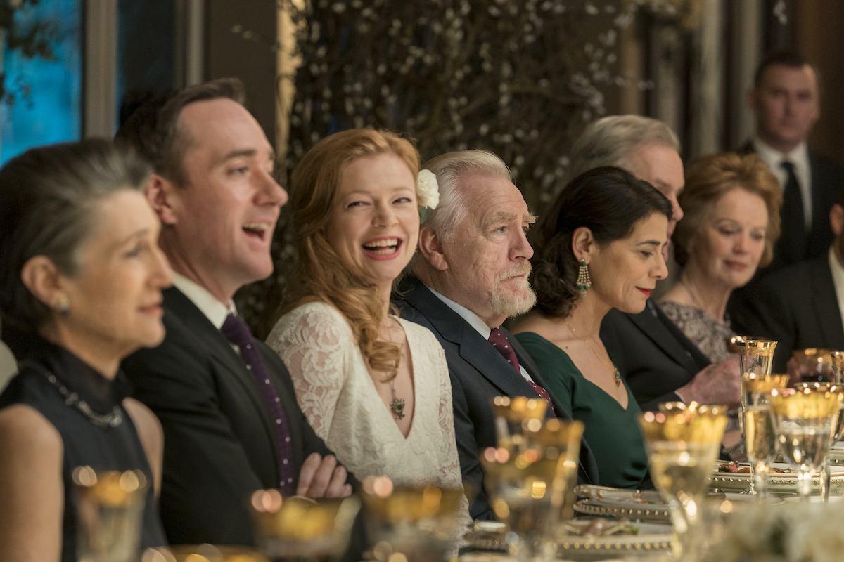 'Succession' cast members Matthew Macfadyen and Sarah Snook laugh at dinner while Brian Cox scowls