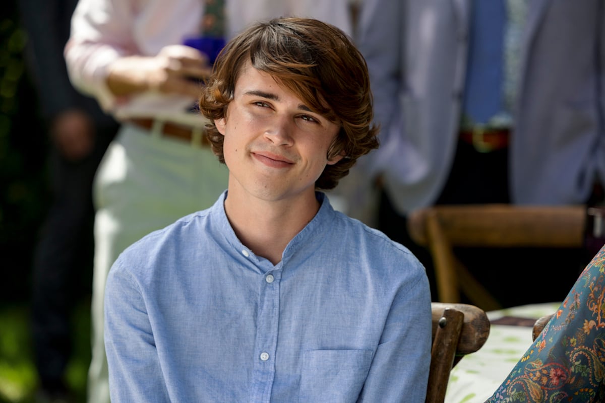 Smiling Kyle wearing a blue shirt in 'Sweet Magnolias' Season 2