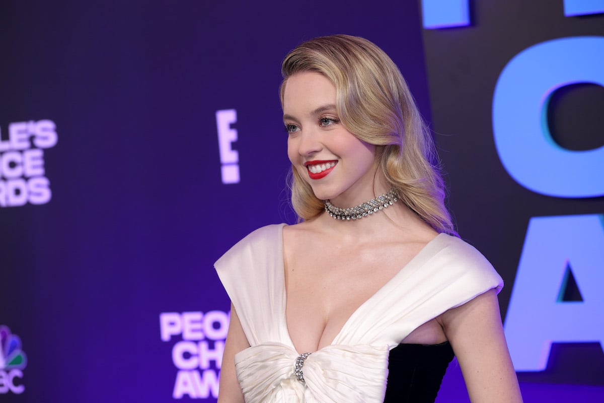 Euphoria star Sydney Sweeney smiles in a black and white dress