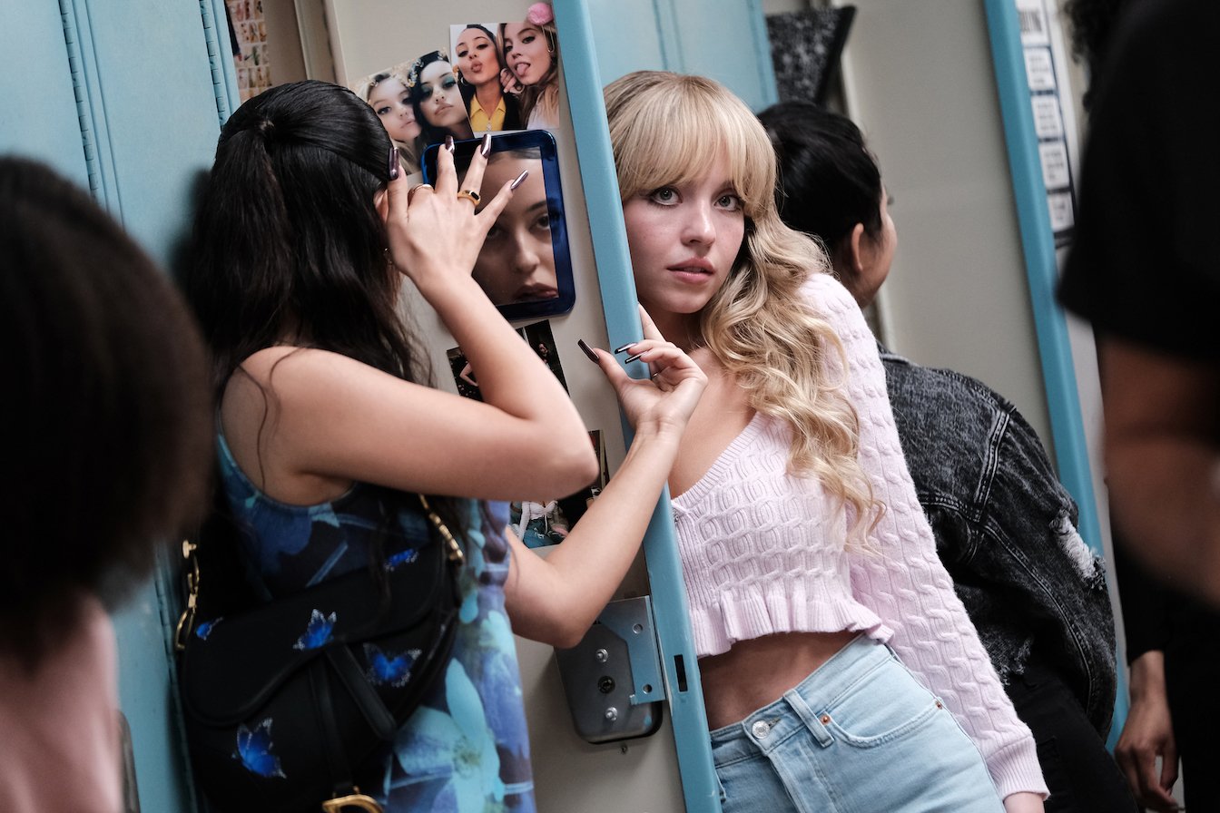 Maddy looking at her locker mirror and Cassie looking away in 'Euphoria' Season 2