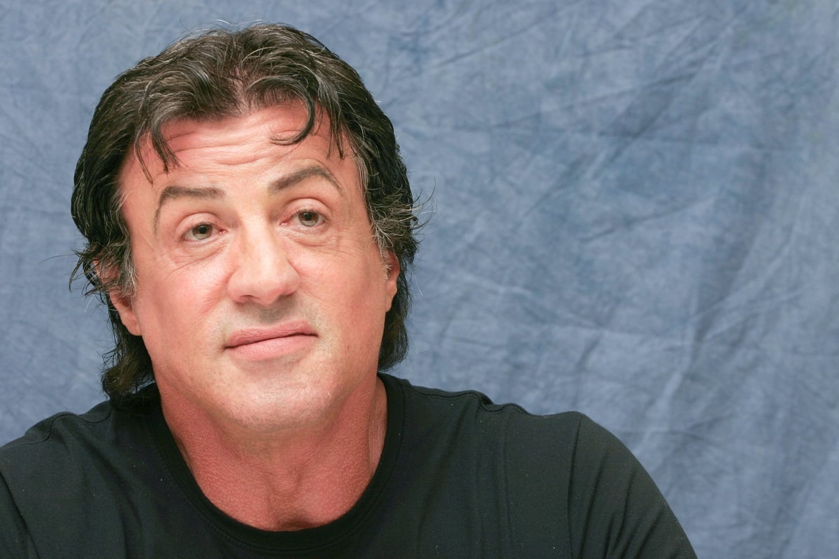 Sylvester Stallone smirking.