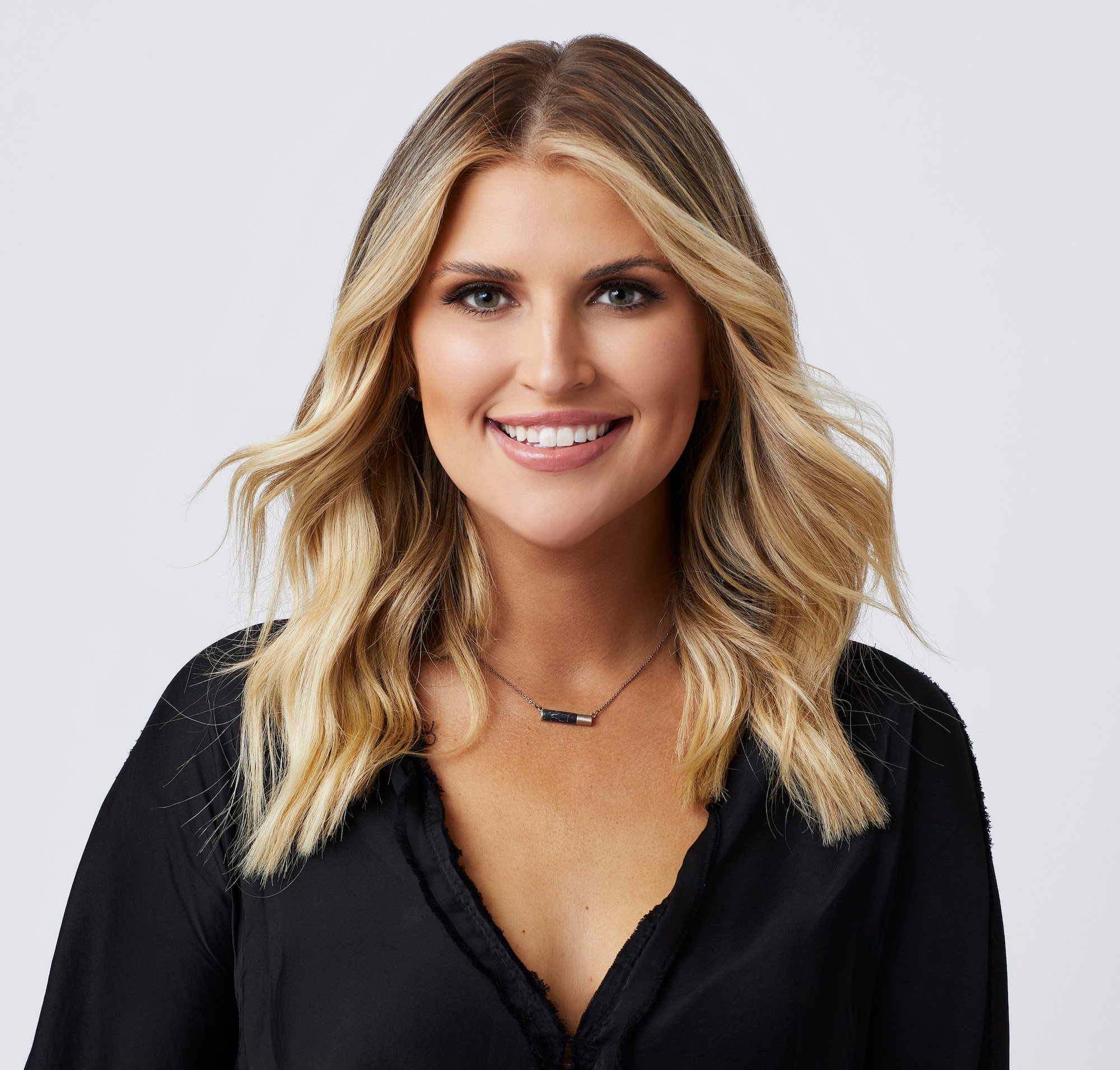 'The Bachelor' 2022 contestant Claire Heilig in a black shirt in a promotional image for the show