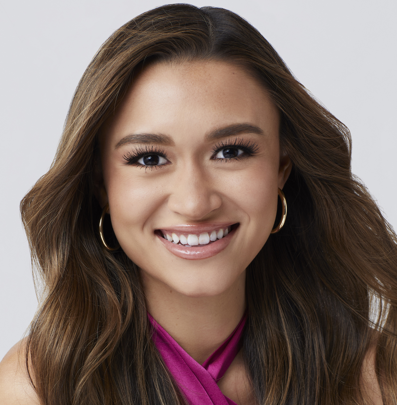 'The Bachelor' 2022 contestant Sarah Hamrick seen here wearing a pink halter top in a promotional image for the show.