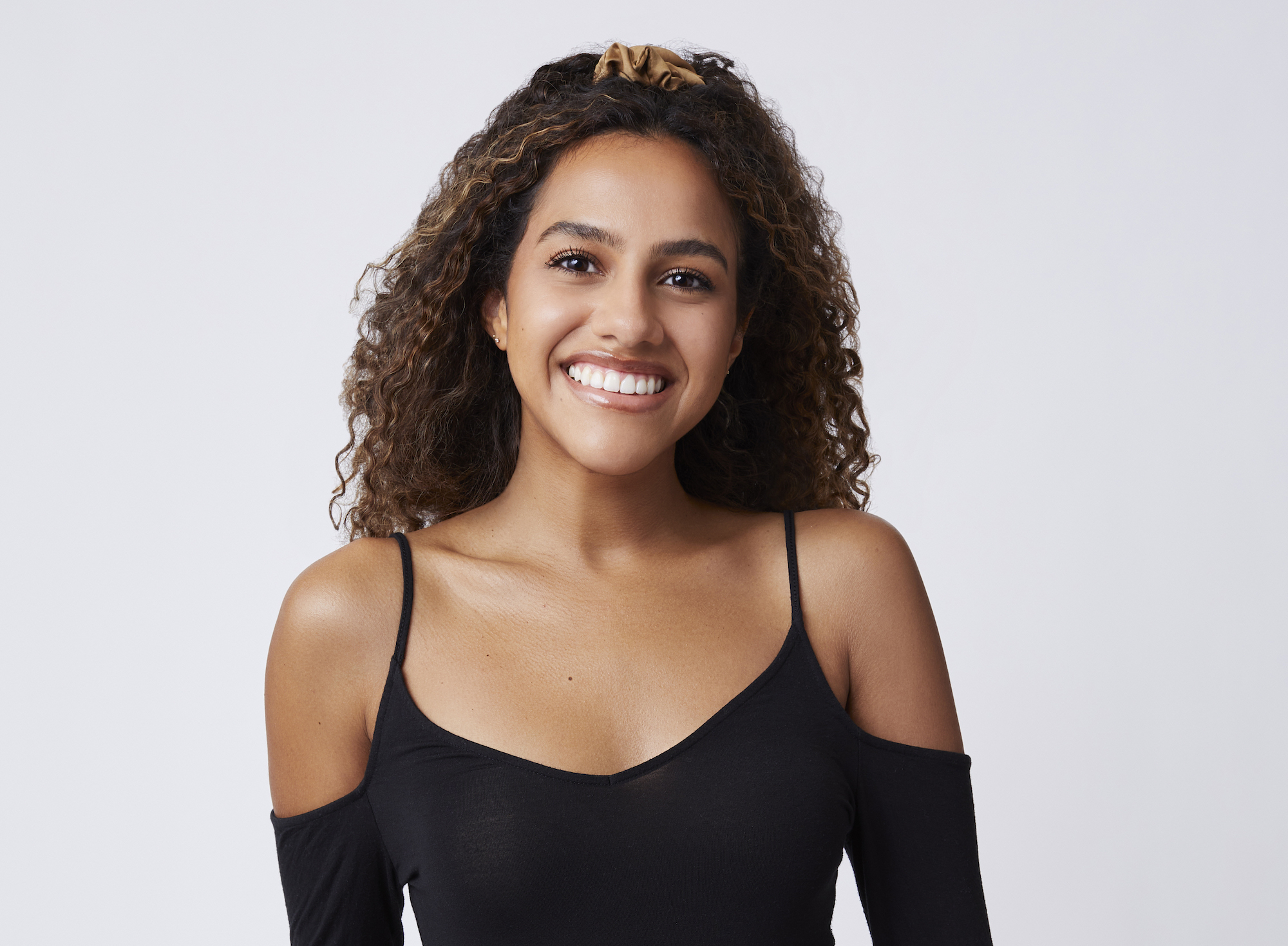 'The Bachelor' 2022 contestant Teddi Wright seen here in a promotional image wearing a black cold shoulder top