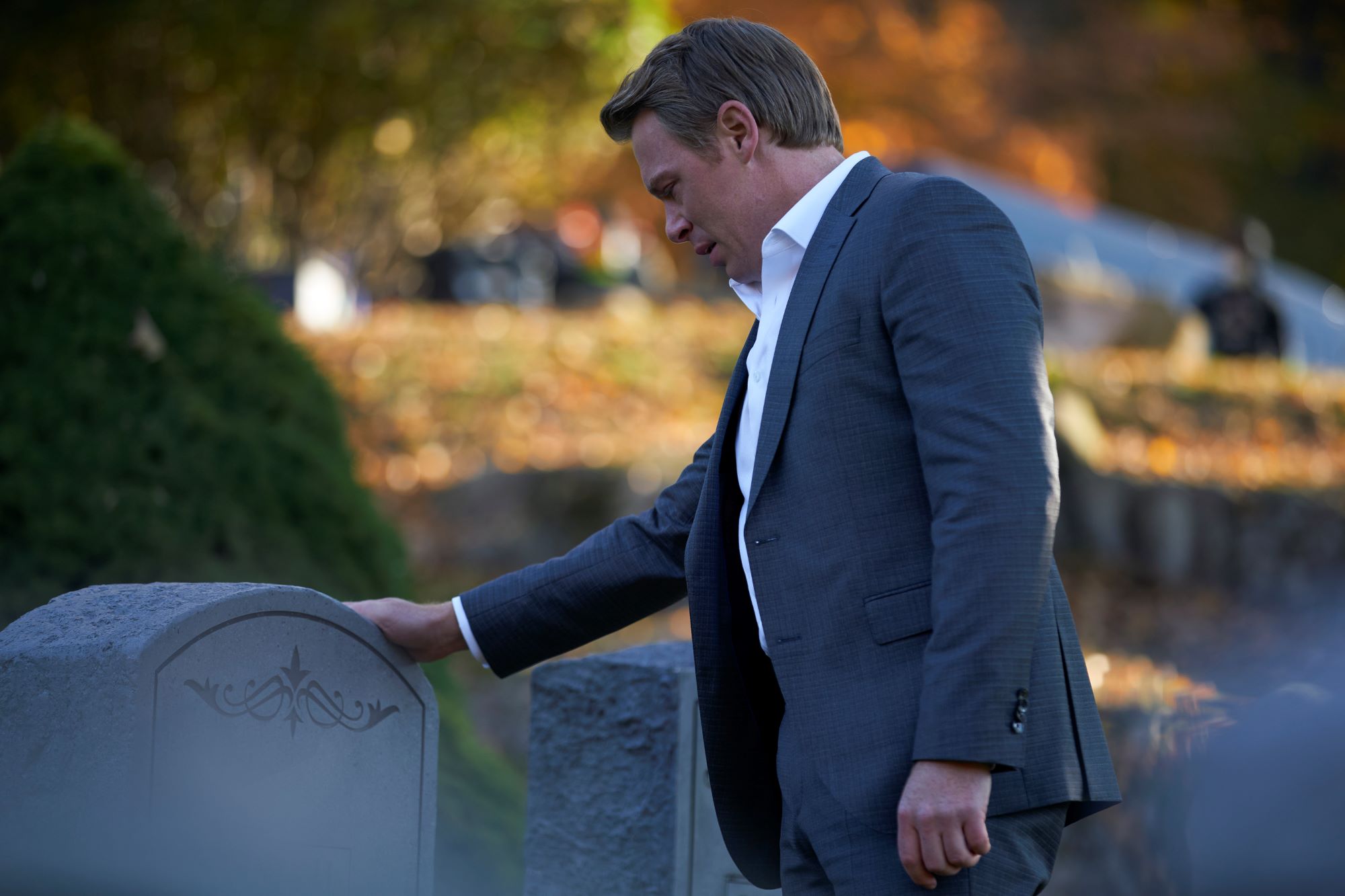 'The Blacklist' Season 9 star Diego Klattenhoff, in character as Donald Ressler, wears a gray suit over a white button-up shirt as he visits a grave. 'The Blacklist' Season 9 is new tonight, Jan. 6, with episode 7.