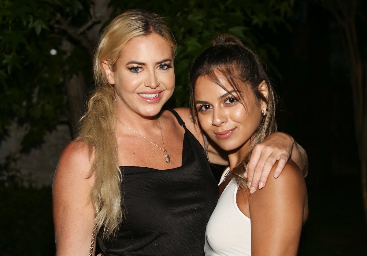 Jemmye Carroll (L) and Amber Martinez smiling together at the Reality Rushmore: Paramount + MTV 'The Challenge' reunion event 