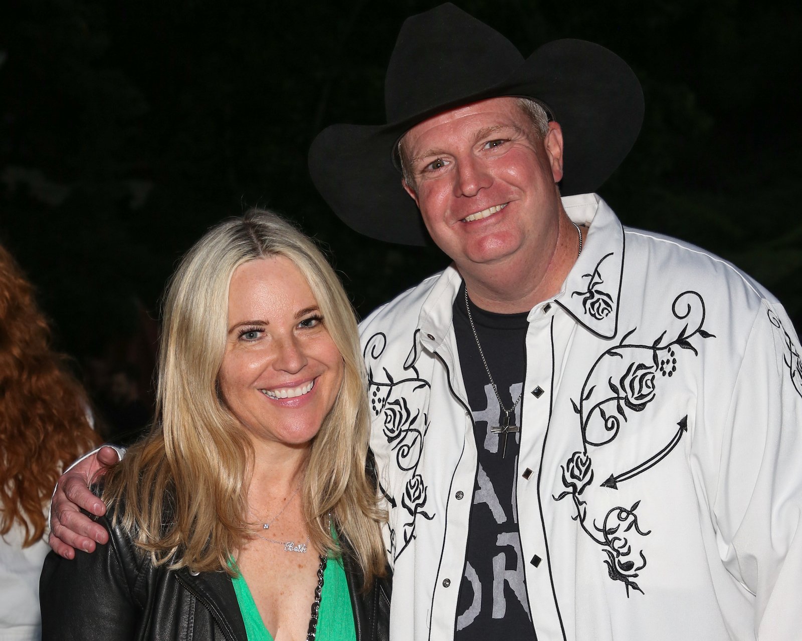 Beth Stolarczyk (L) from 'The Challenge: All Stars' and Jon Brennan smiling at the camera