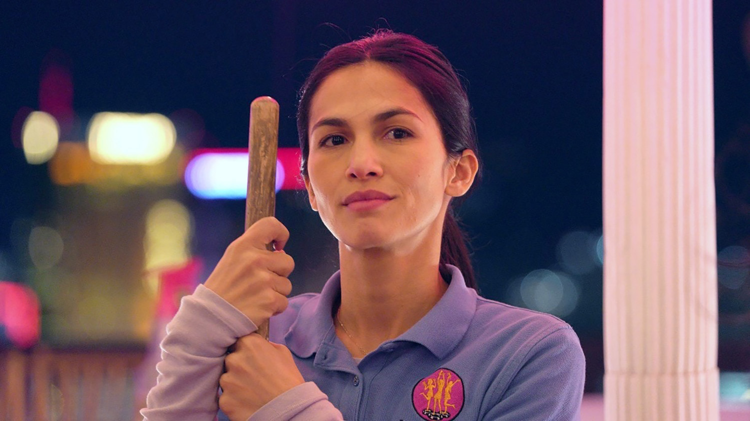 Elodie Yung as Thony De La Rosa holding a mop in The Cleaning Lady