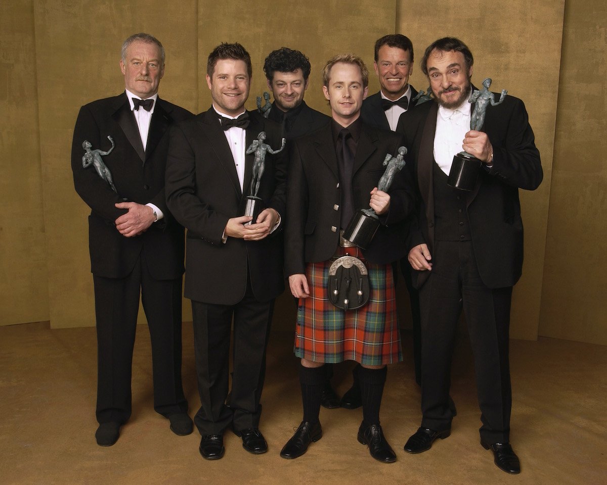 Bernard Hill, Sean Astin, Andy Serkis, Billy Boyd, John Noble, and John Rhys-Davies wear suits and pose with their Screen Actors Guild Awards for ‘The Lord Of the Rings: The Return of the King’