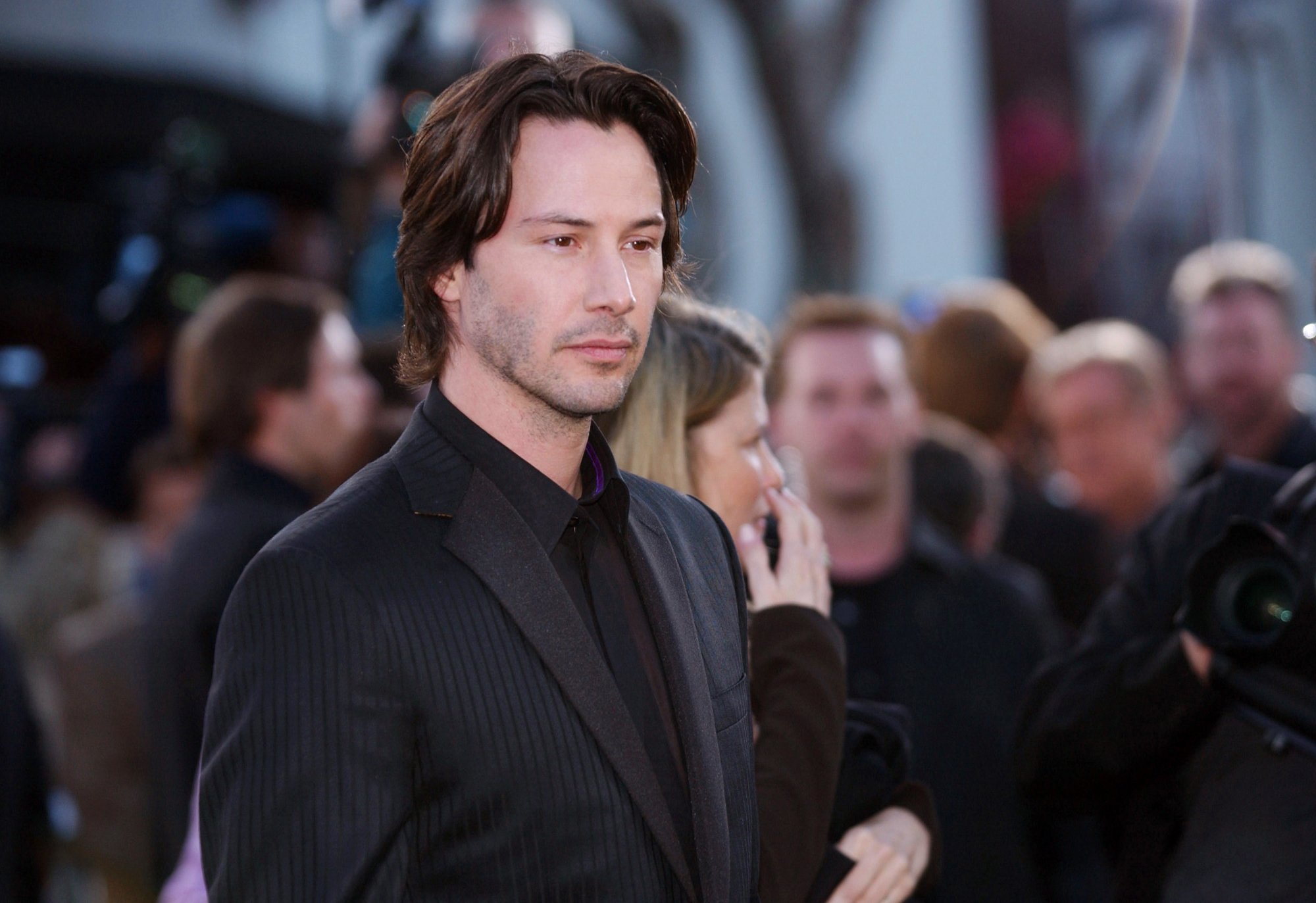 'The Matrix' Keanu Reeves wearing a black suit