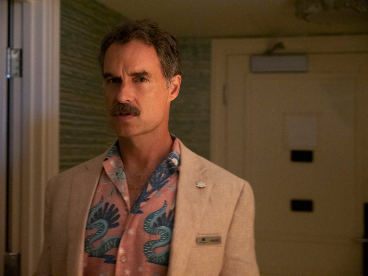 'The White Lotus' star Murray Bartlett enters a hotel room wearing Armond's uniform