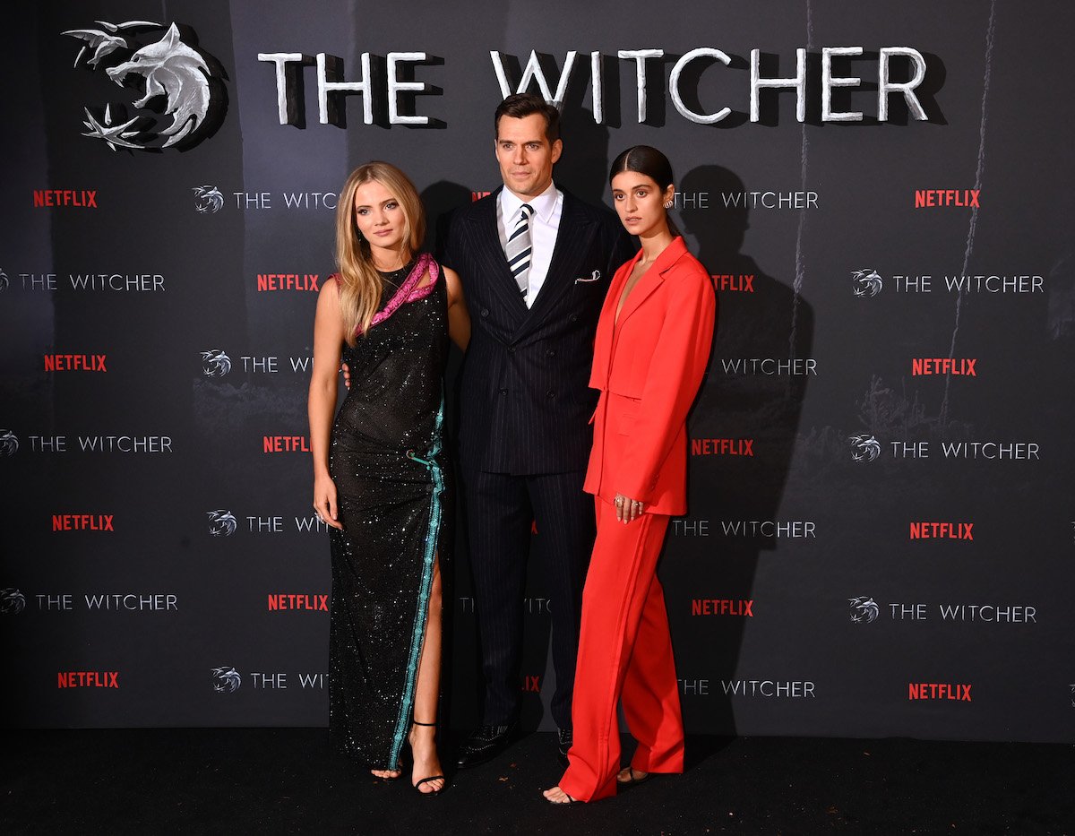 Freya Allan, Henry Cavill, and Anya Chalotra pose at the World Premiere of "The Witcher: Season 2