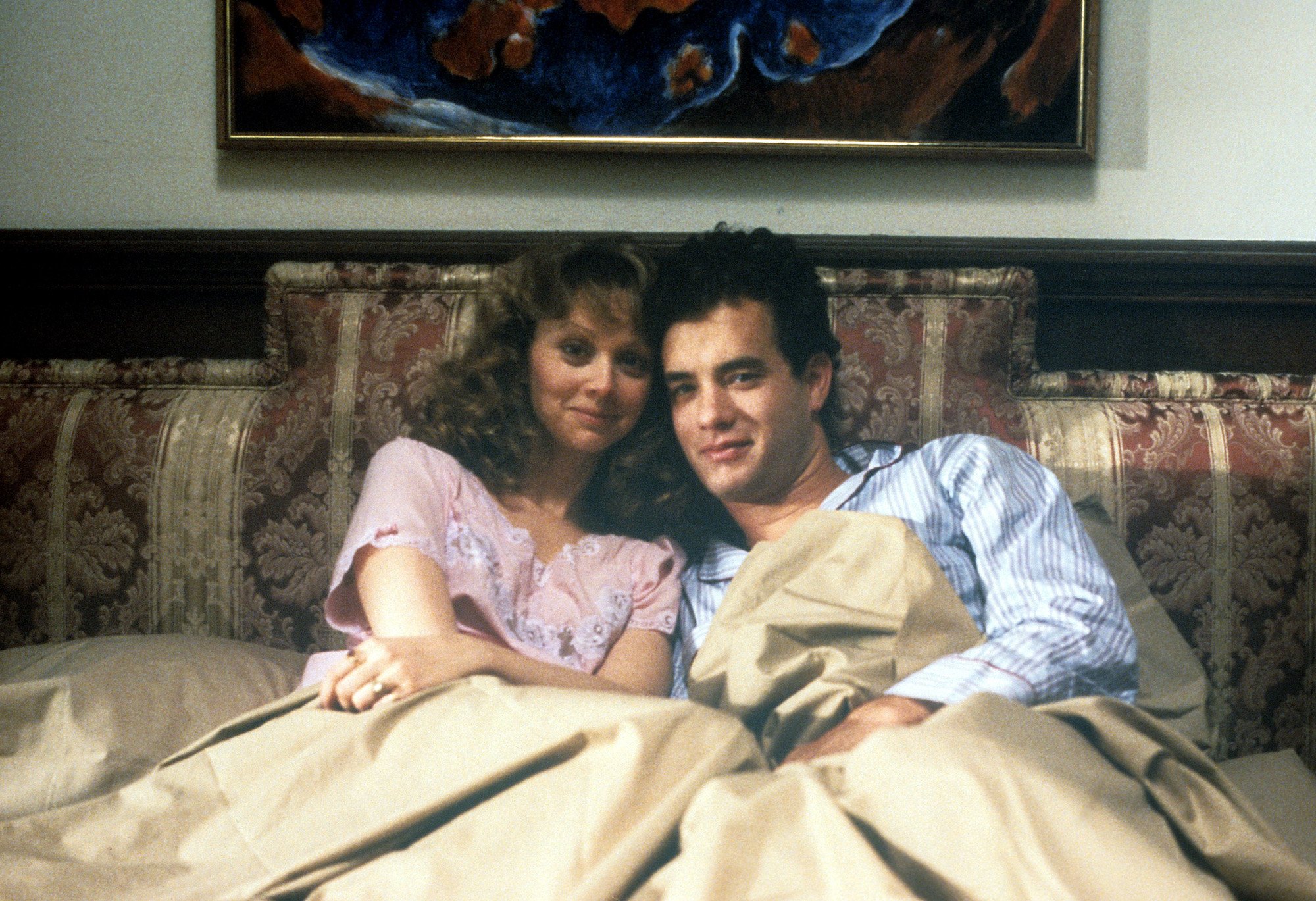 Tom Hanks sits in bed with Shelley Long in 'The Money Pit'