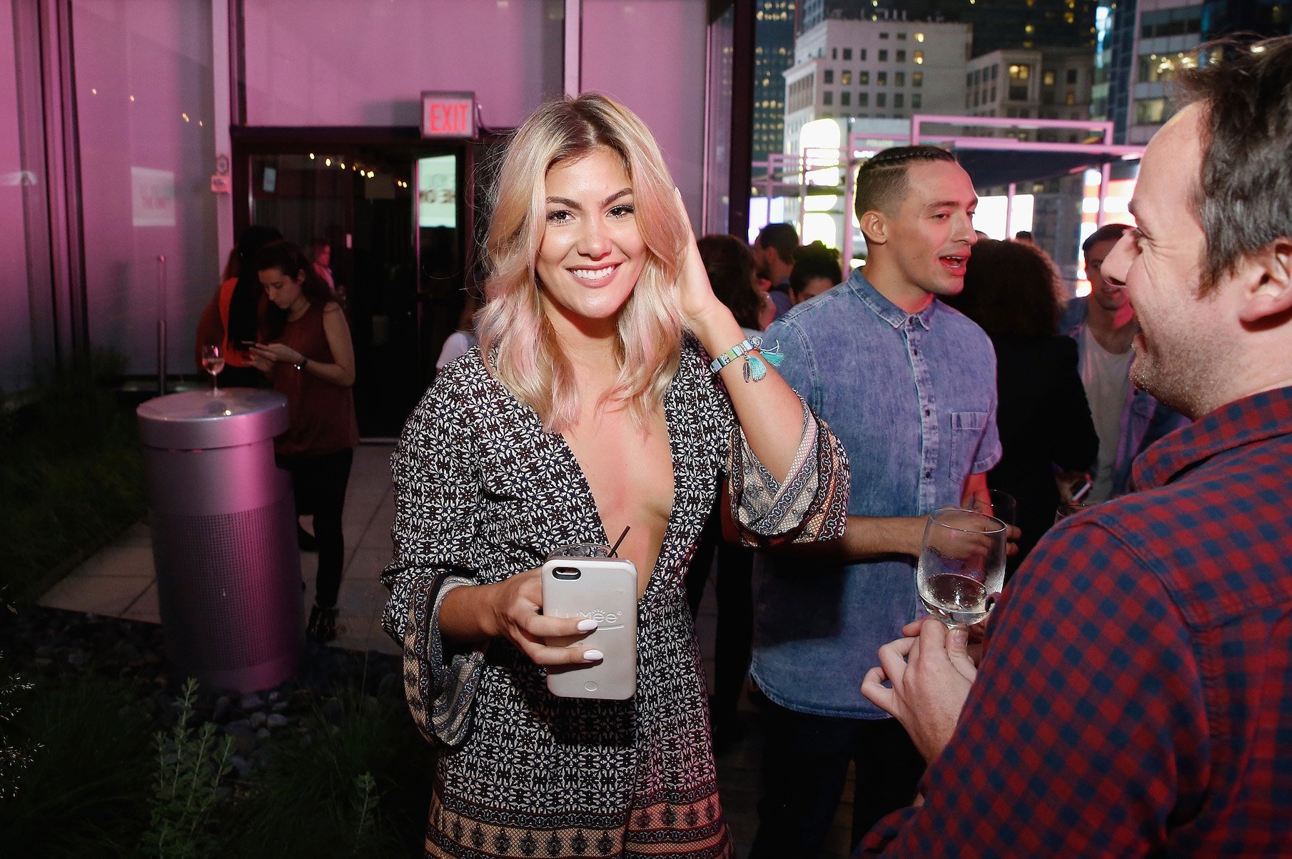 Tori Deal from MTV's 'The Challenge' Season 37 at an 'Are You the One?' event smiling and holding a drink