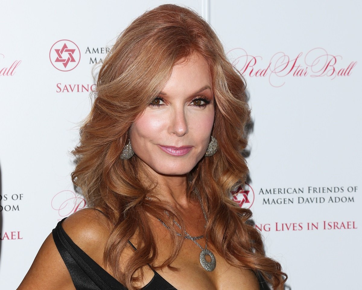 'The Young and the Restless' actor Tracey E. Bregman wearing a black dress and silver jewelry.