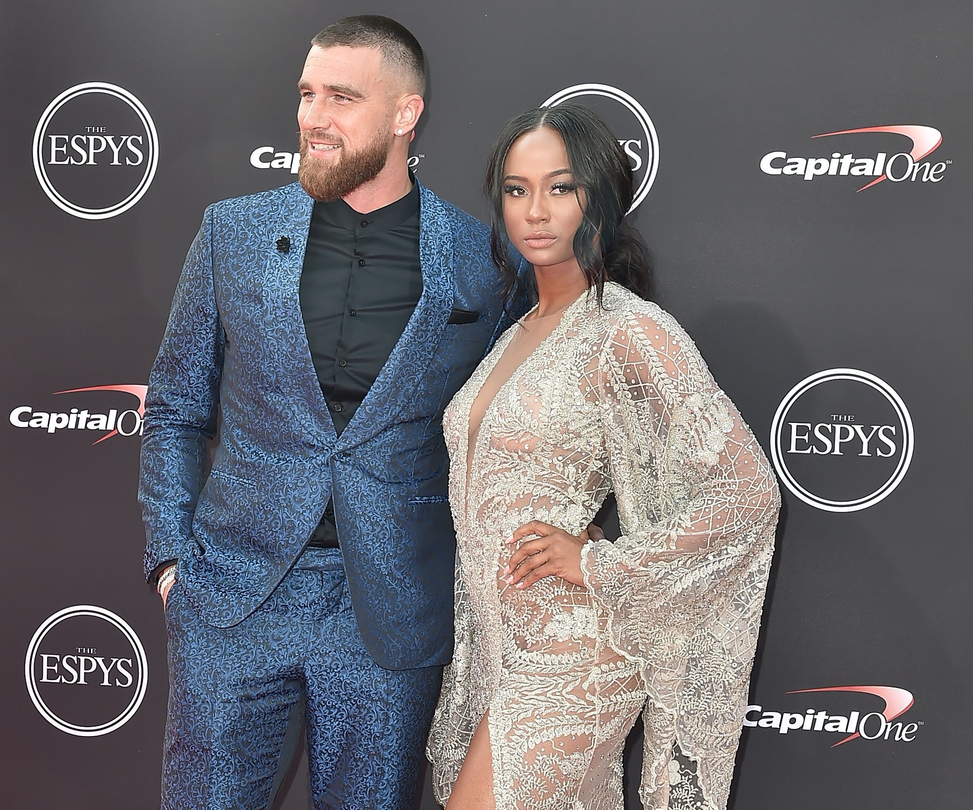 Travis Kelce and Kayla Nicole posing on the red carpet at the ESPYS