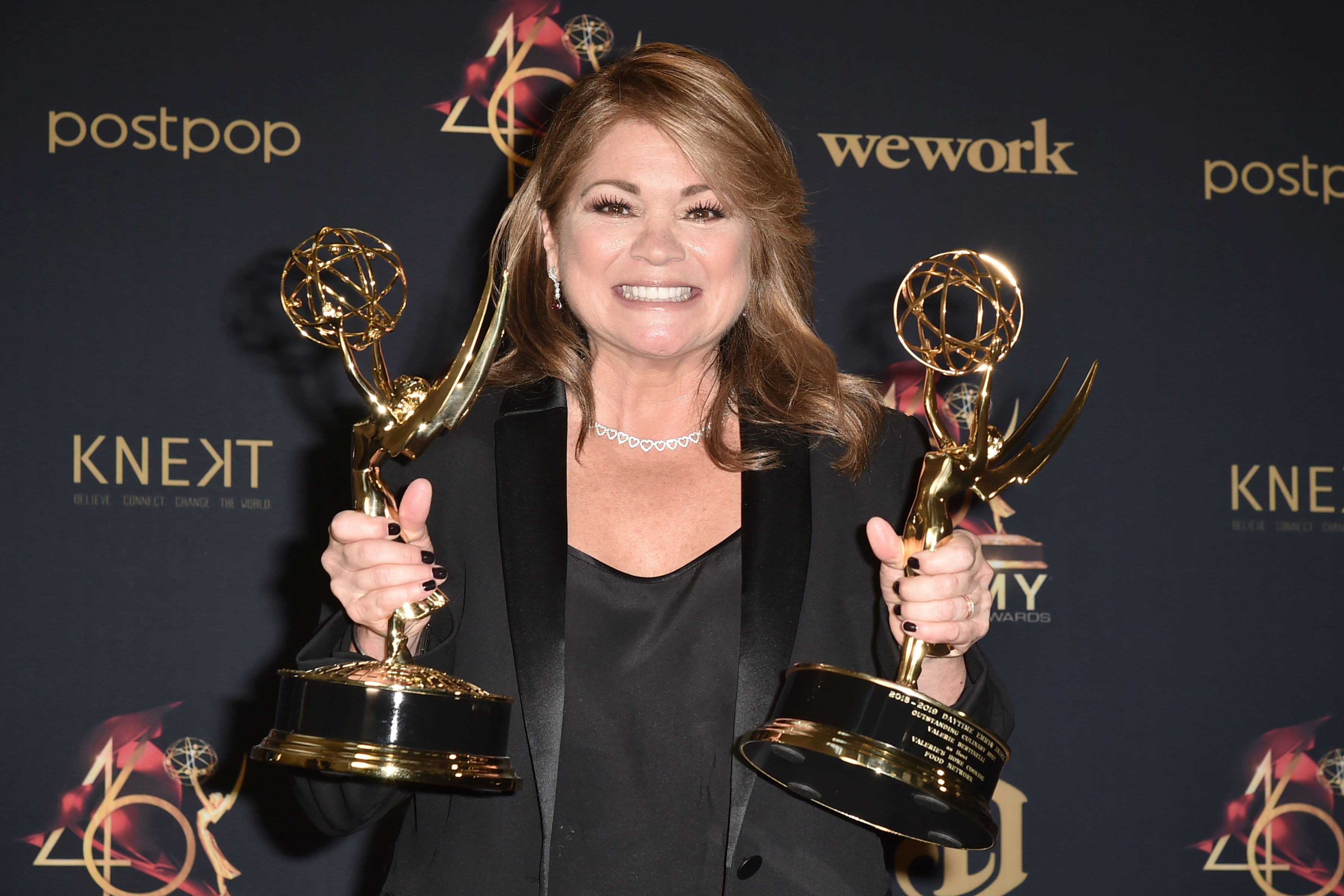 Food Network personality Valerie Bertinelli shows off her 2 Daytime Emmy awards in 2019.