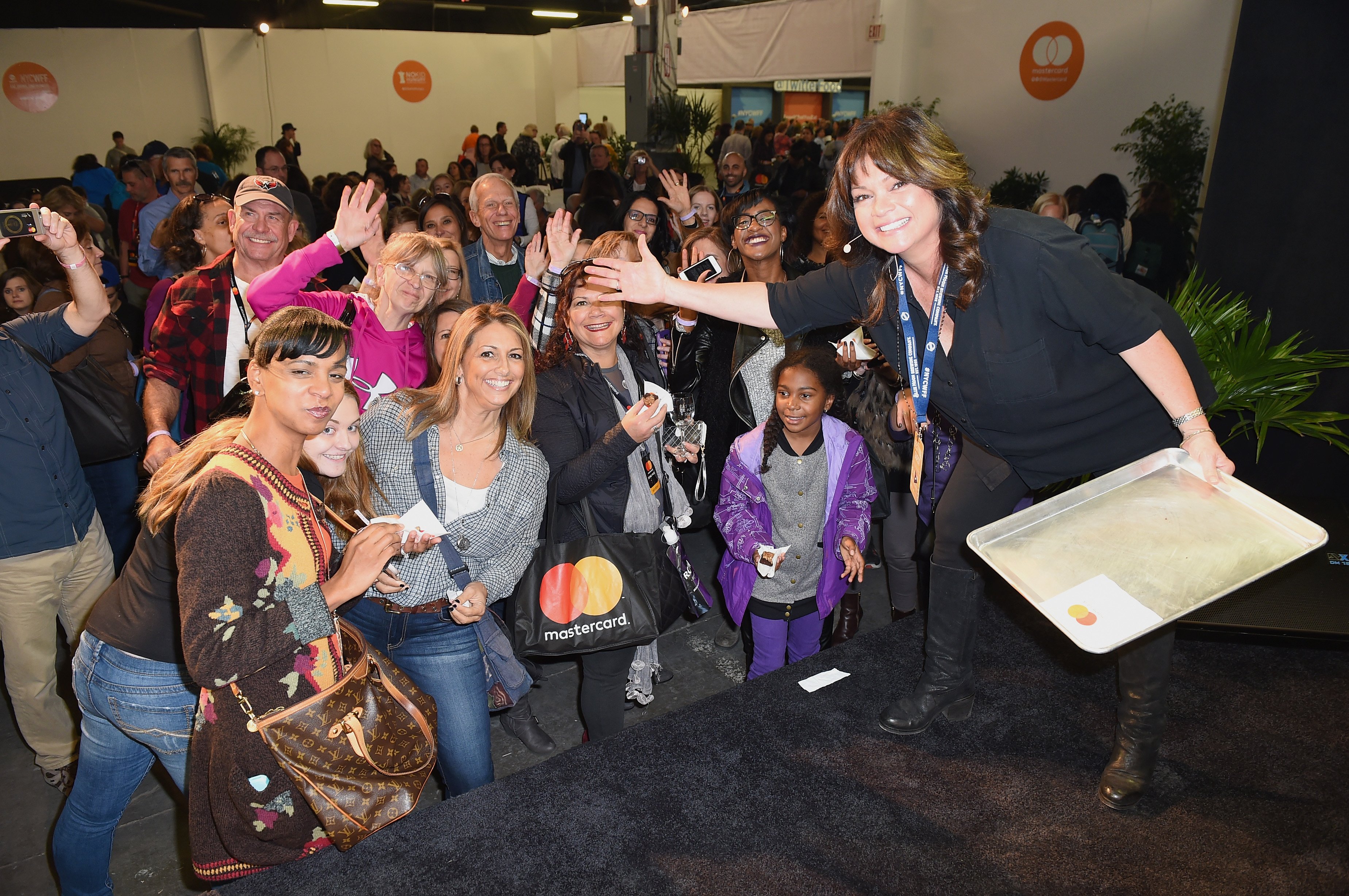 Food Network personality Valerie Bertinelli poses with fans at a Food Network event