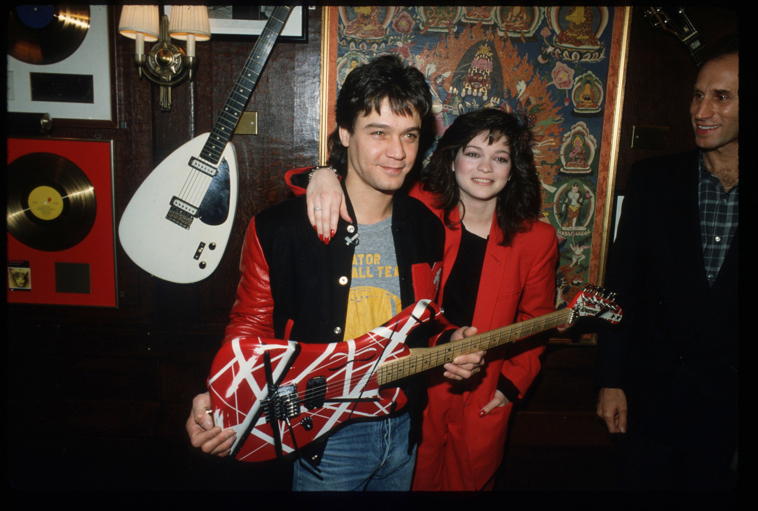 Actor Valerie Bertinelli, right, with then-husband guitarist Eddie Van Halen as he donates a red guitar to Hard Rock Cafe in 1995.