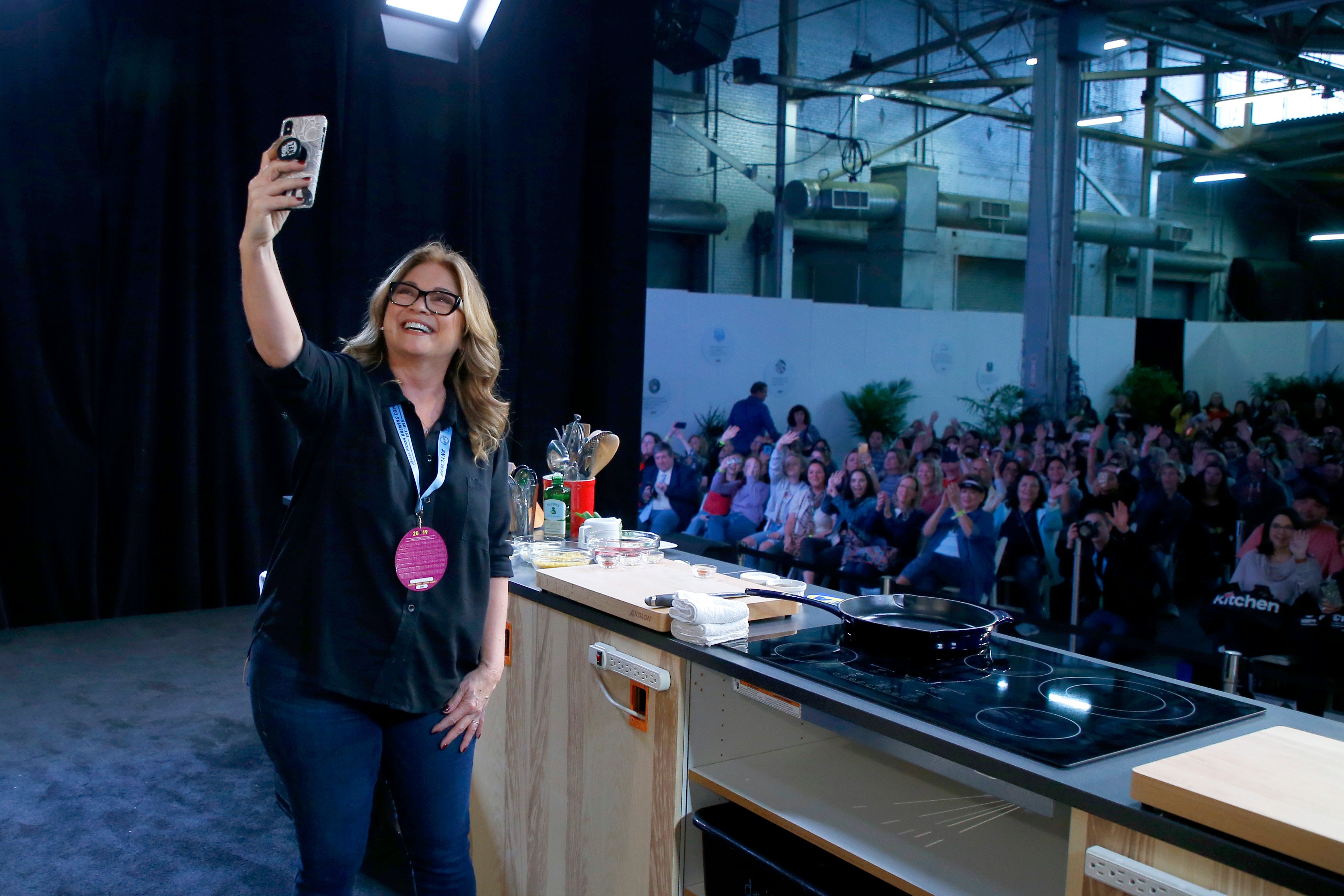Valerie Bertinelli takes a selfie with fans at a 2019 Food Network/Cooking Channel event.