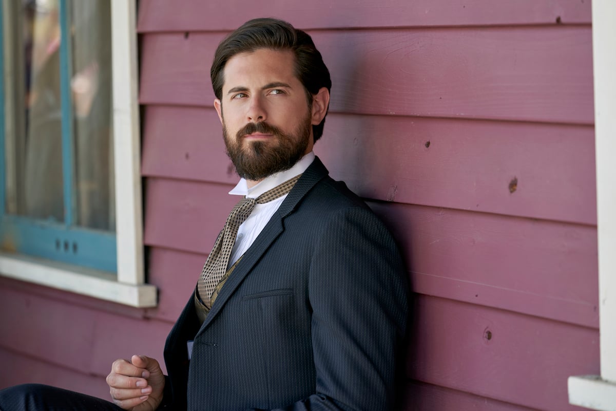 Chris McNally as Lucas, with a beard and wearing a suit, in 'When Calls the Heart' Season 8