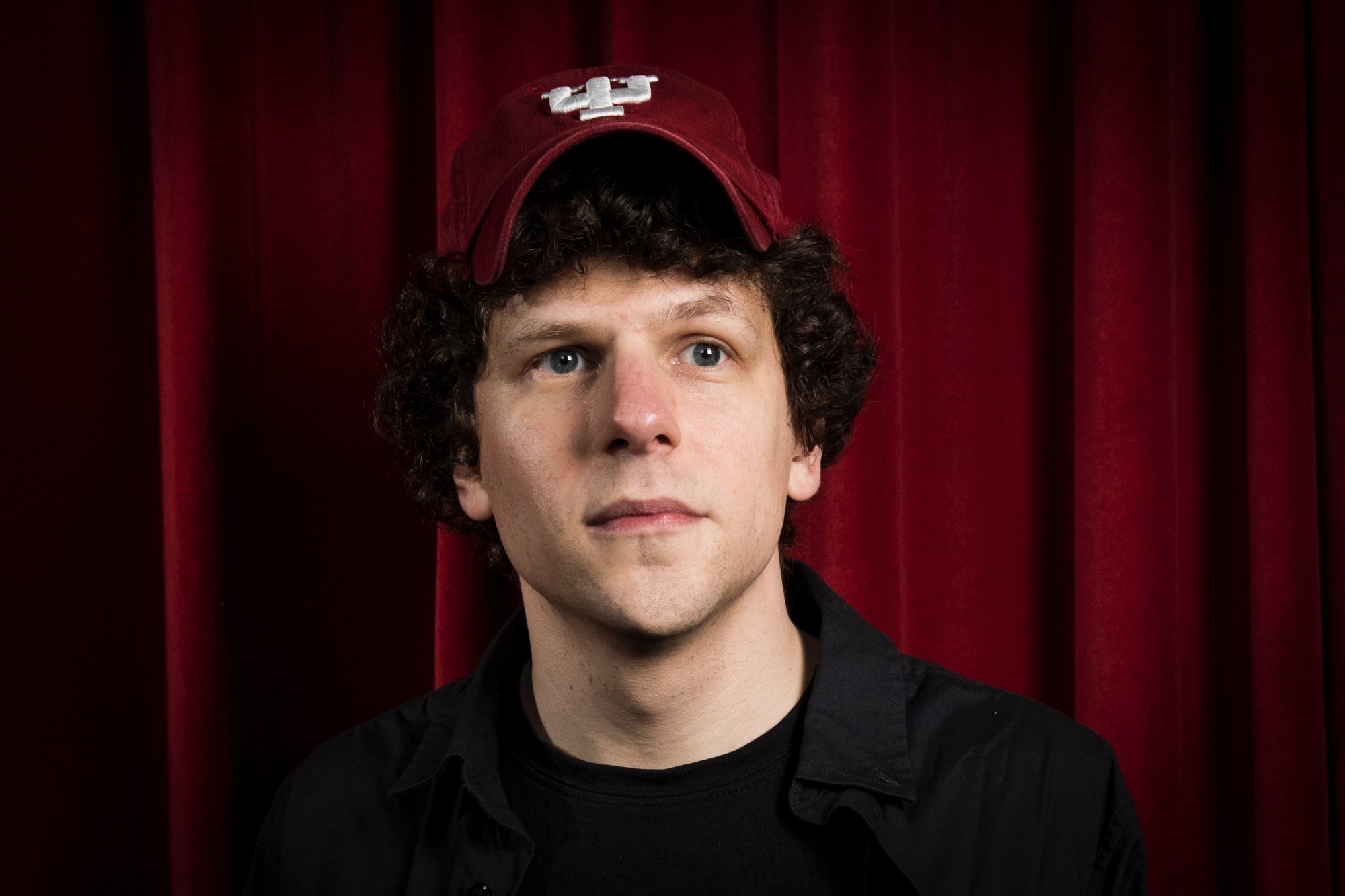 'When You Finish Saving the World' filmmaker Jesse Eisenberg wearing a red cap