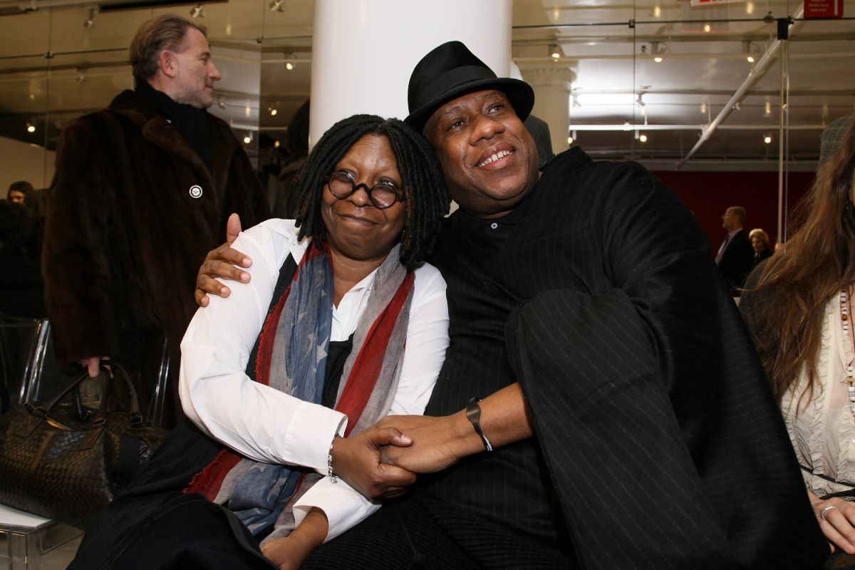 Whoopi Goldberg and Andre Leon Talley holding hands